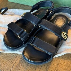 Gucci Black Sandals with Gold Accents